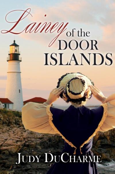 Title Lainey of the Door Islands. Lainey holding on to her hat as she gazes at the lighthouse.