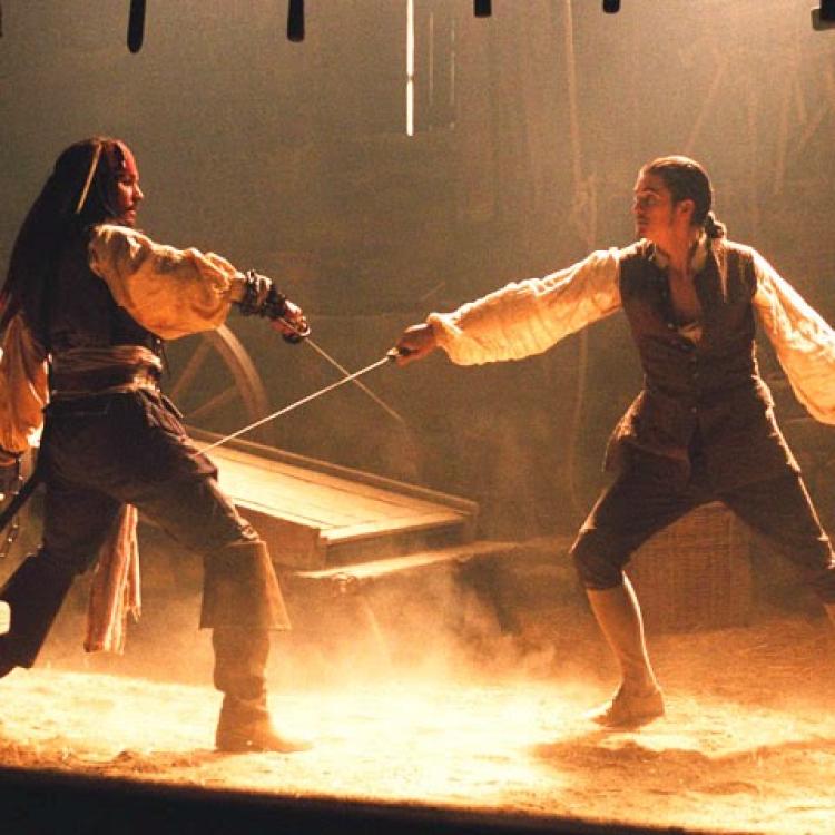 Firstly, I love this image of a fight scene in the Pirates of the Caribbean. Secondly, this image has nothing to do with The Grotto's Secret, I just love the image because it conjurs up delicious images of a great fight fight scene. The lighting helps to give the image a medieval glow.  So, to my fight scenes in my conspiracy thriller.